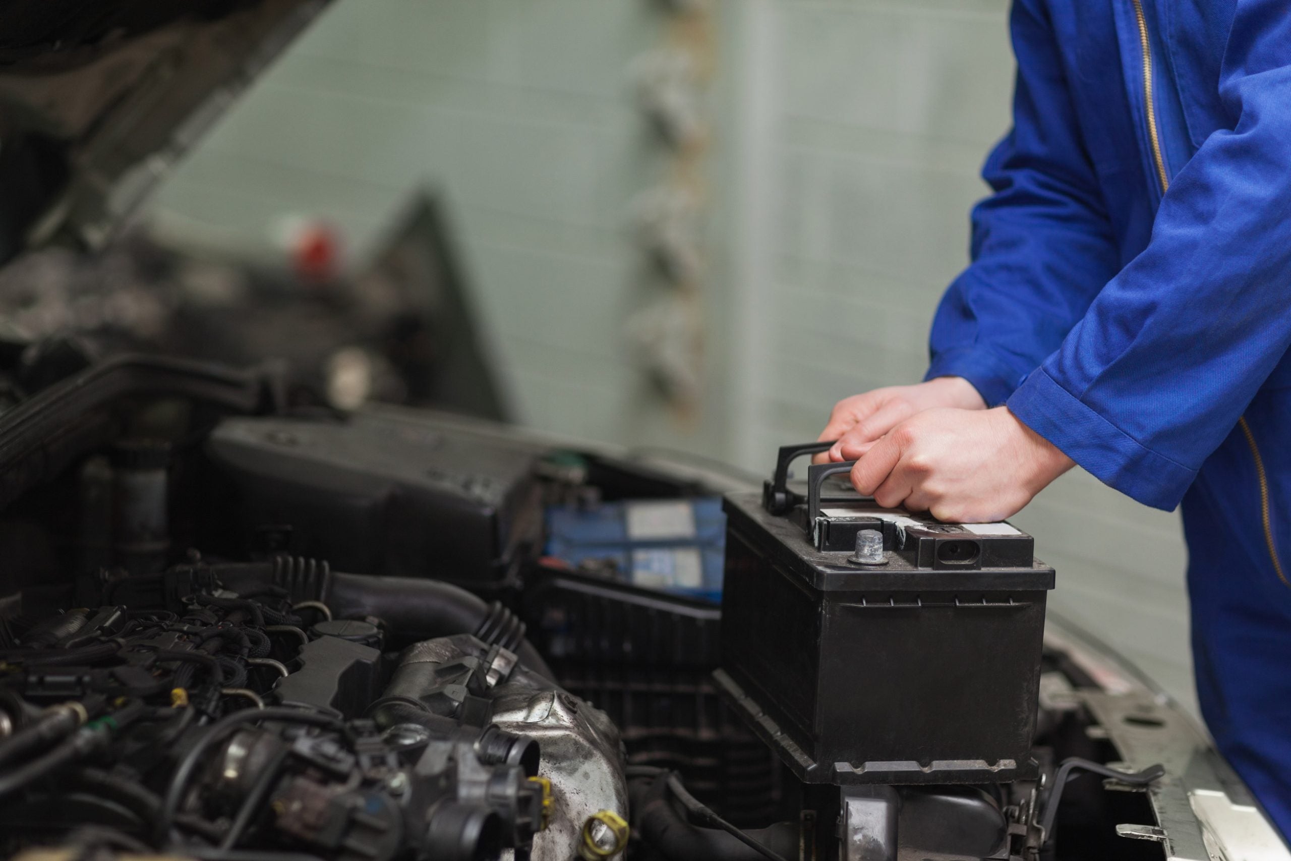 Hyundai service technician installing a battery