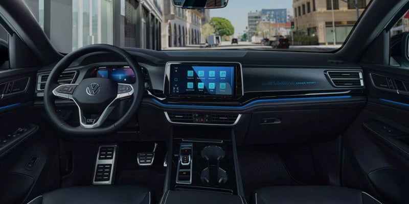 Interior view of the 2025 Volkswagen Atlas Cross Sport, showcasing modern design, leather seats, and advanced technology features.