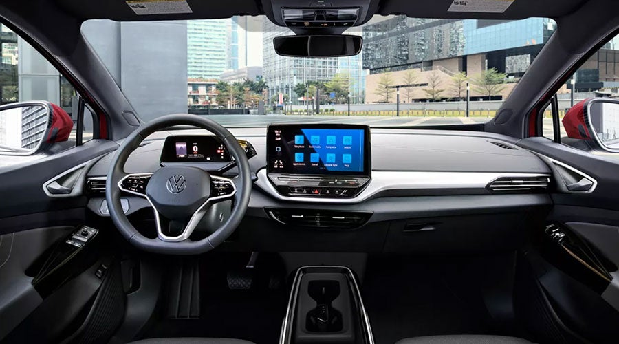 Volkswagen car interior dashboard with steering wheel and touchscreen display