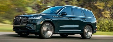 2026 Lincoln Aviator driving down the road