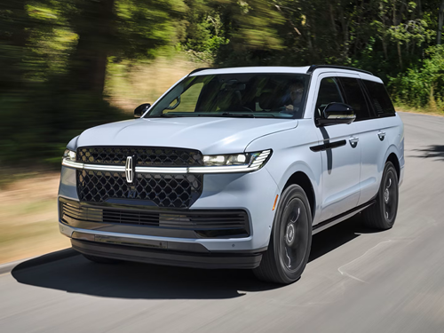 Lincoln SUV driving down the road