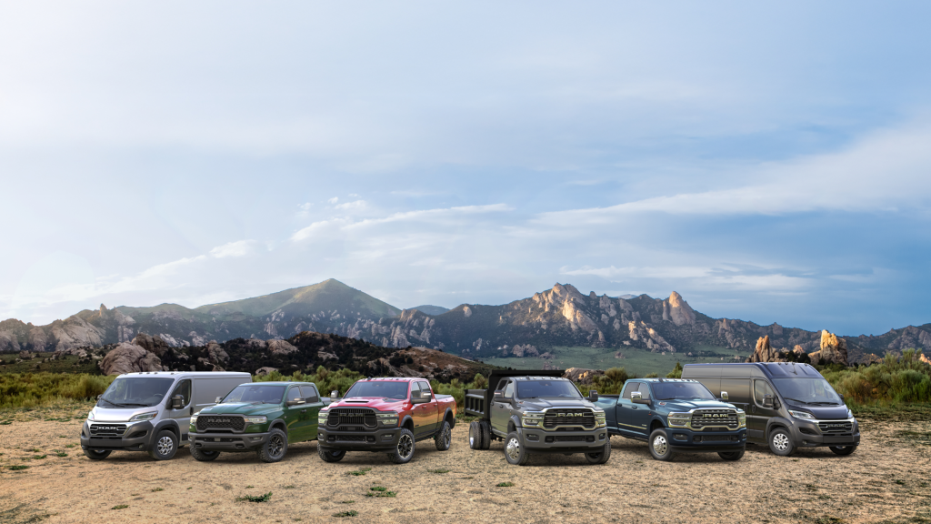 Ram Commercial Van lineup, surrounded by mountains.