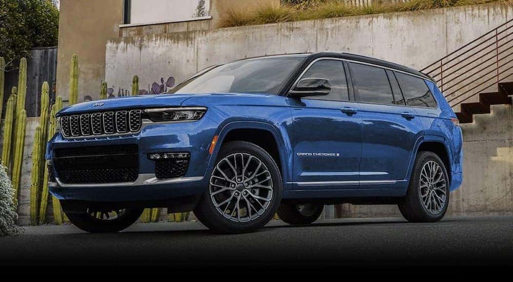 A blue 2022 Jeep Grand Cherokee is shown from the front at an angle after leaving a Jeep dealer near Shelbyville.