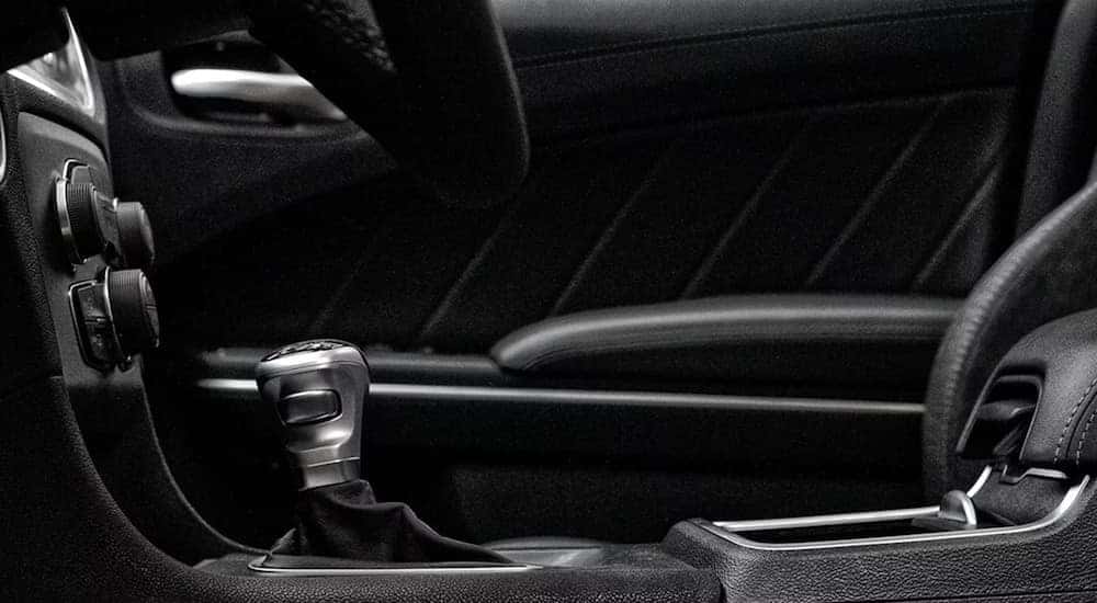 A close up of the center console in a 2023 Dodge Charger is shown at a Dodge dealership.