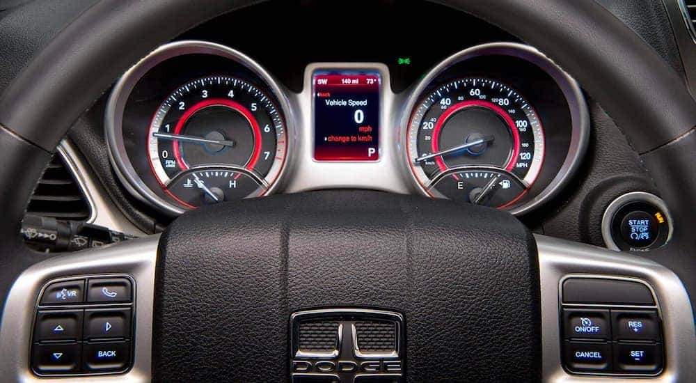 A close up shows the gauge cluster of a 2020 used Dodge Journey