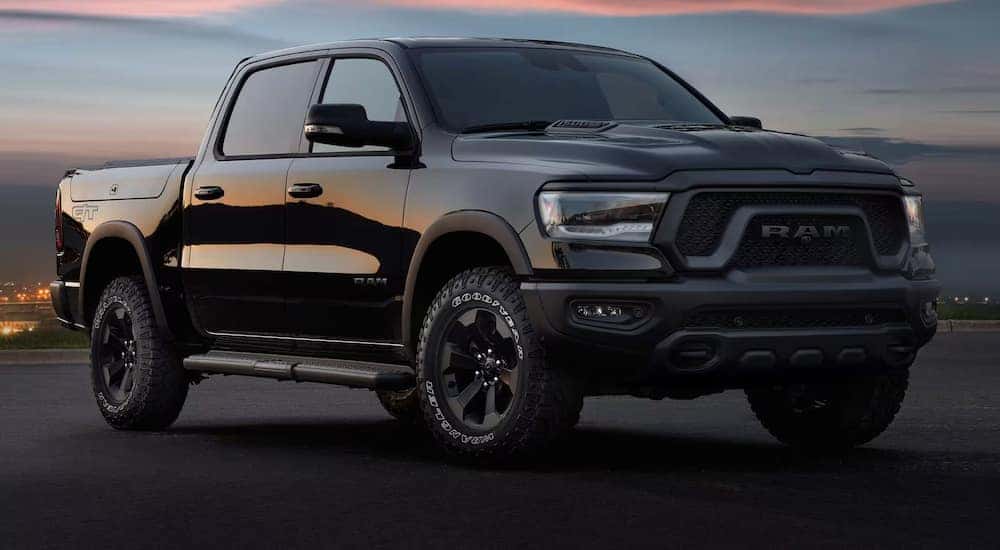 A black 2024 Ram 1500 Rebel GT for sale near Lawrenceburg at dusk.