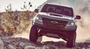 A 2020 Chevy Colorado ZR2 is shown from the front off-roading.