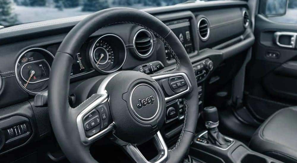 The steering wheel of a 2021 Jeep Wrangler is shown.