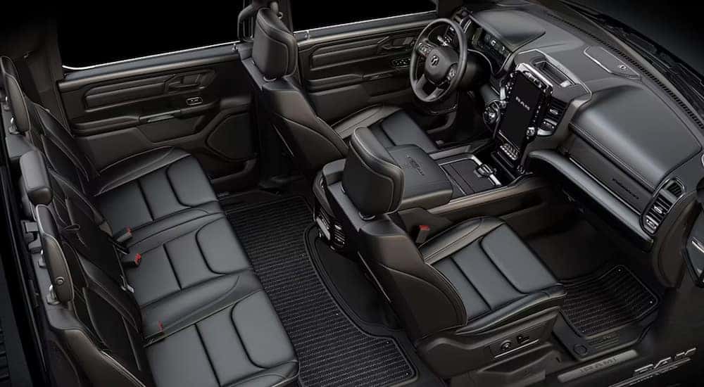 An overhead view of the black interior seating and dashboard of a 2024 Ram 1500 Limited DT.