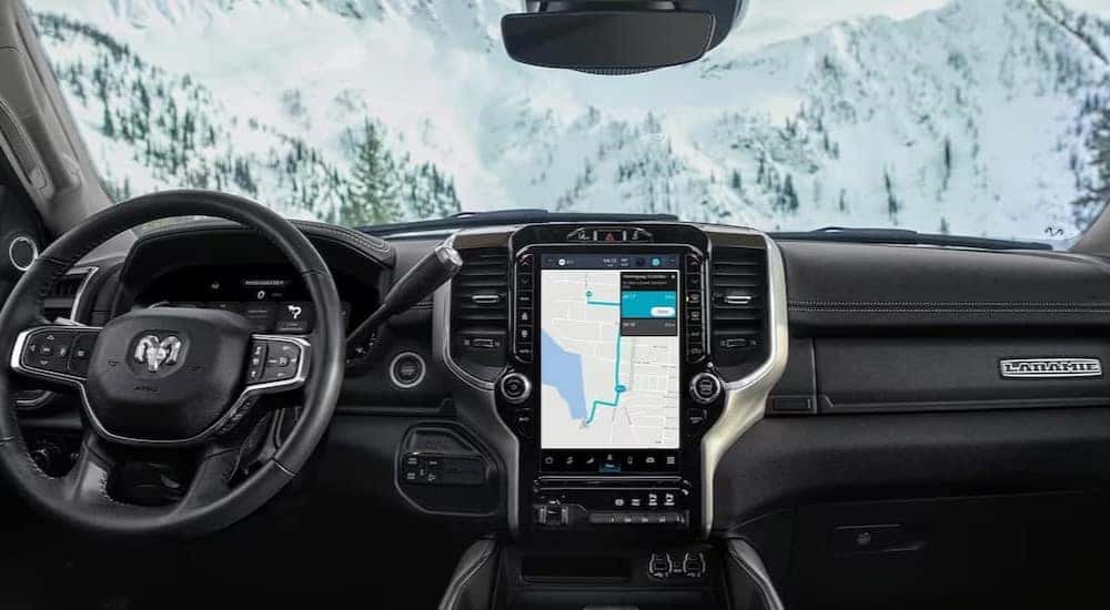 The black interior and dash of a 2023 Ram 2500 Laramie is shown.