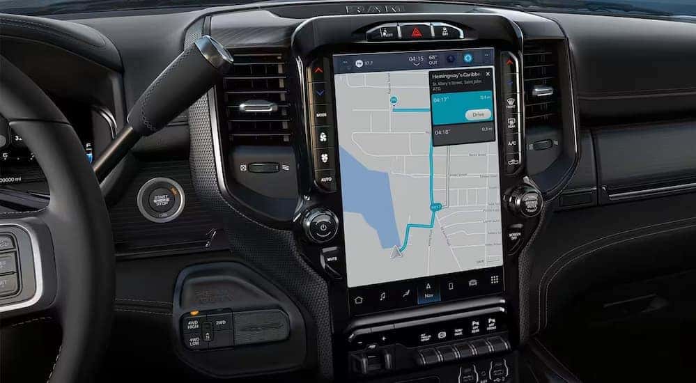 A close-up of the infotainment screen in a 2024 Ram 2500 is shown.