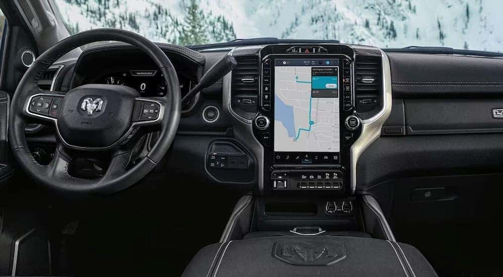 The black interior and dash of a 2024 Ram 2500 is shown.