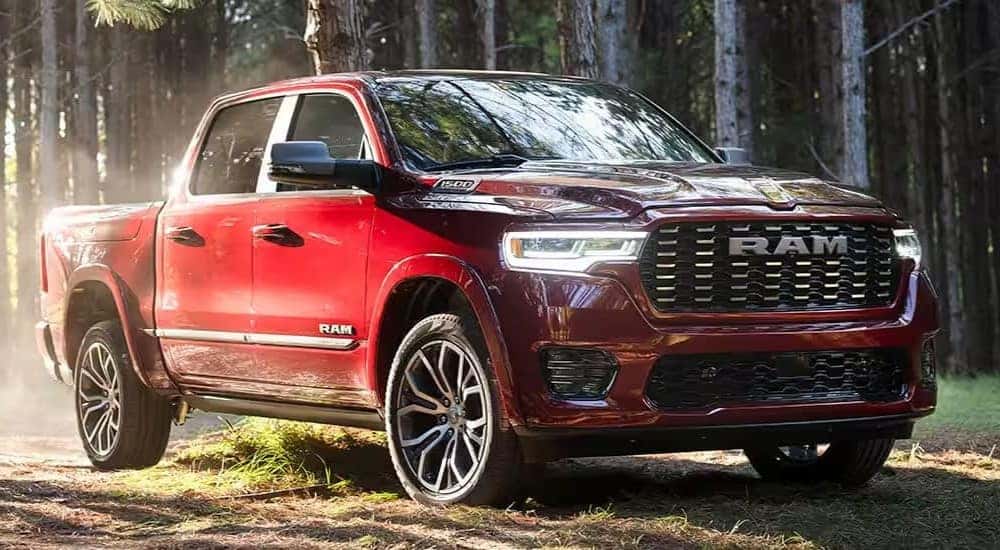 A red 2025 Ram 1500 for sale is shown parked off-road.