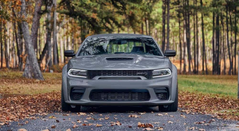 A grey 2023 Dodge Charger SRT Hellcat is shown from the front after leaving a used Dodge dealership.