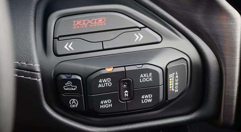 A close up of buttons in a 2025 Ram 1500 RHO at a Ram dealer near Independence.