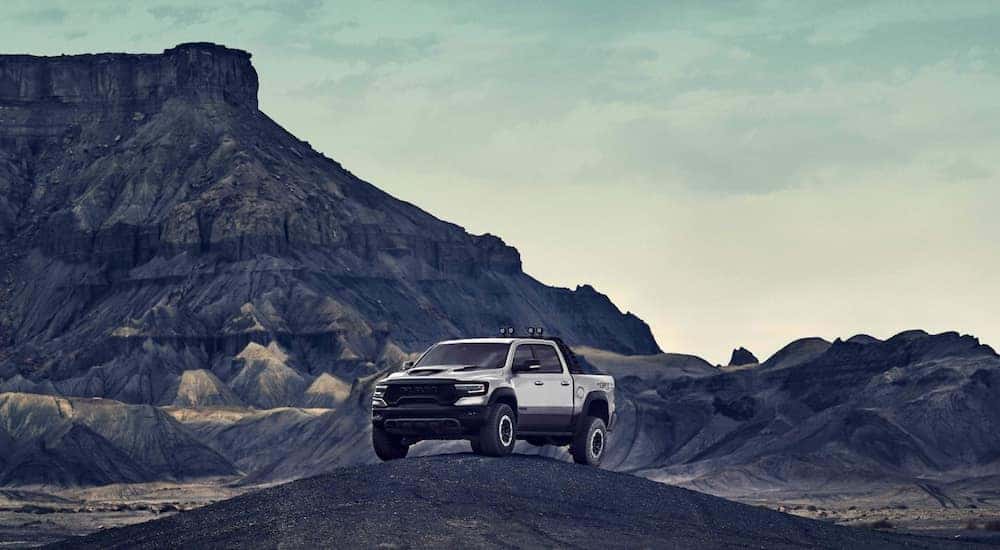 A grey 2021 Ram TRX is parked on top of a dirt mound after leaving a Ram TRX dealer in Kentucky.