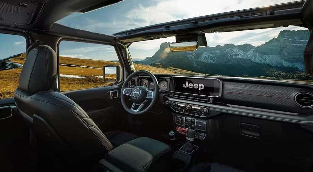 The black interior and dash of a 2024 Jeep Wrangler is shown after visiting a Jeep dealer near Shelbyville.