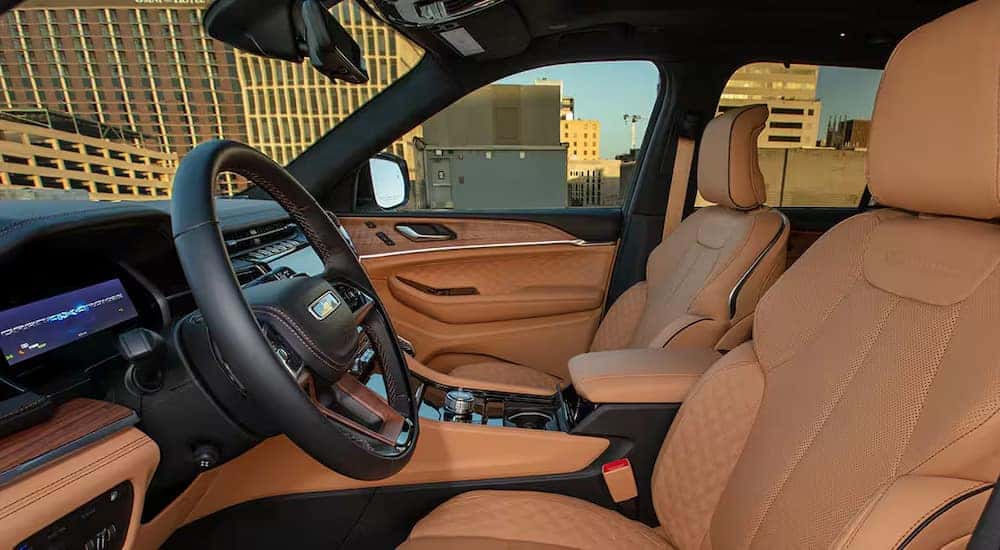 The tan leather interior of a 2024 Jeep Grand Cherokee 4xe at a Jeep dealer near Covington.