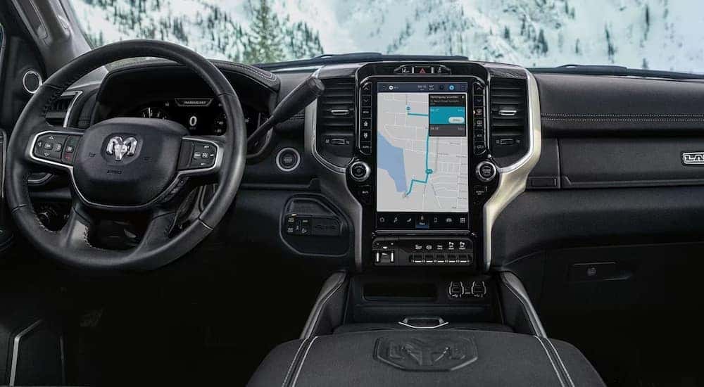 The black interior of a 2024 Ram 2500 HD Laramie is shown from above the center console.
