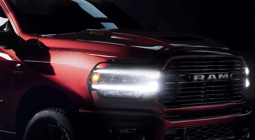 A red 2024 Ram 2500 HD Limited is shown from the front at an angle in close-up.