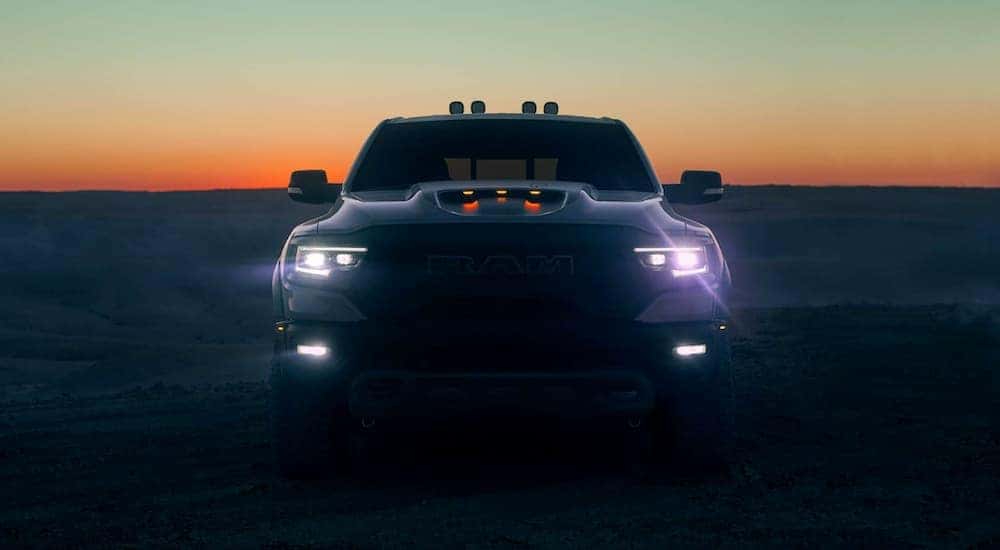 A 2021 Ram 1500 TRX is shown from the front at sunset near Lexington, KY.