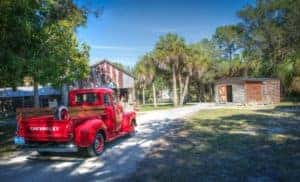 A red Chevy truck outside a home