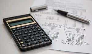 A calculator on a stack of papers