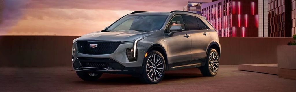 2025 Cadillac XT4 parked in front of a city skyline