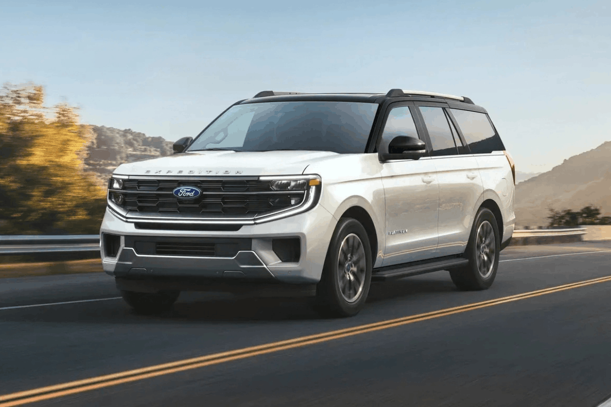 White 2026 Ford Expedition driving on the road