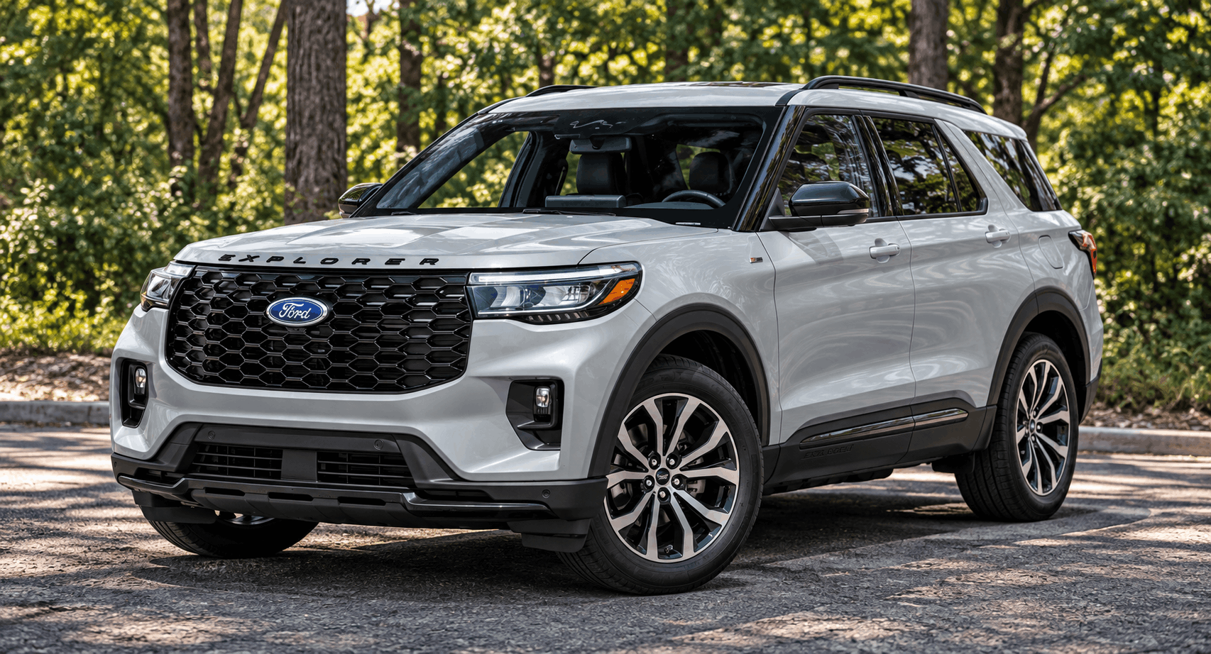 Gray 2026 Ford Explorer on a wooded road