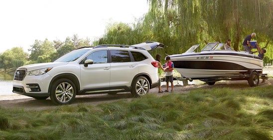 A Subaru towing a boat