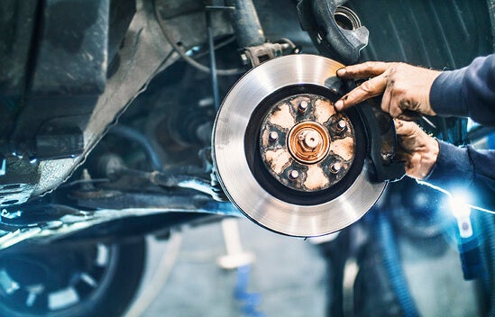A mechanic working on a car