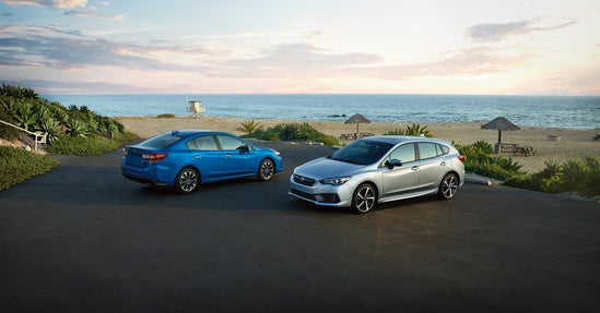 two cars parked in a beach parking lot