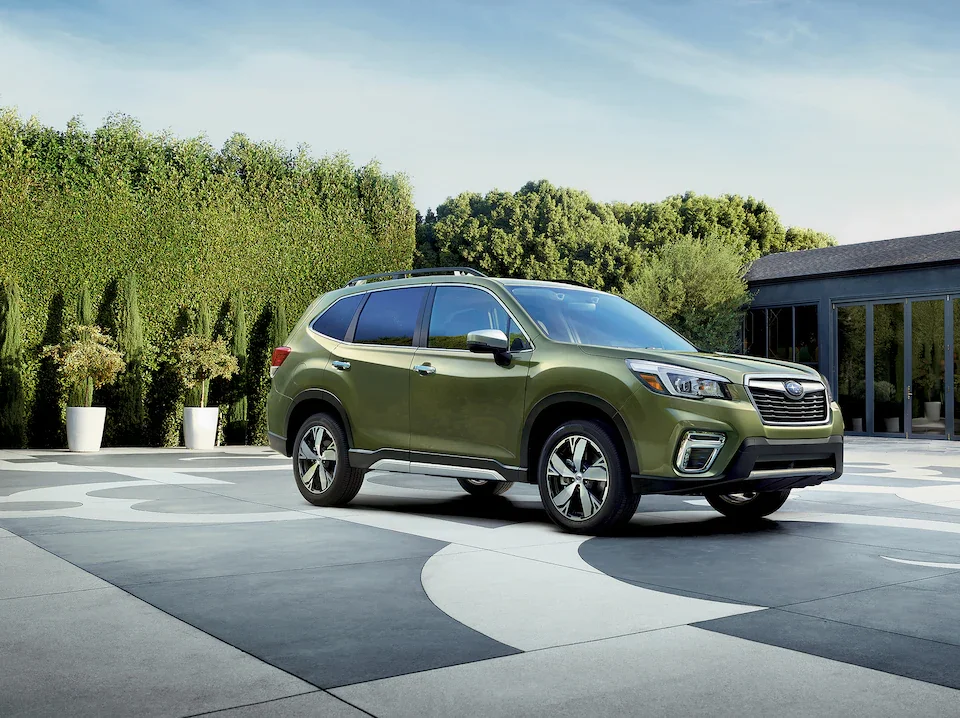 free Subaru Forester parked in the driveway of a modern home