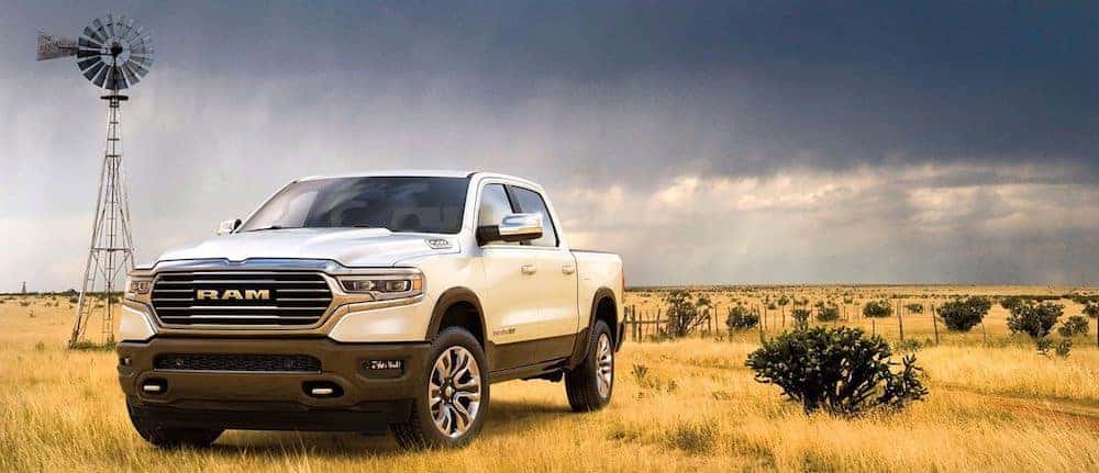A 2020 RAM 1500 Laramie Longhorn parked in a field