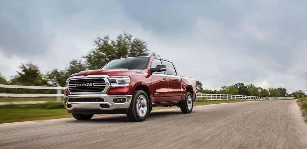 A 2020 RAM 1500 driving on a country road getting excellent fuel efficiency