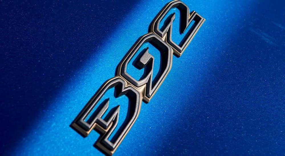 A close up shows the black 392 emblem on a blue 2021 Jeep Wrangler Rubicon 392.
