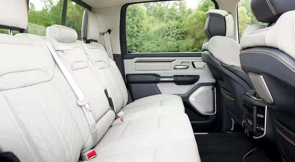 The black and white rear interior of a 2025 Ram 1500 is shown.