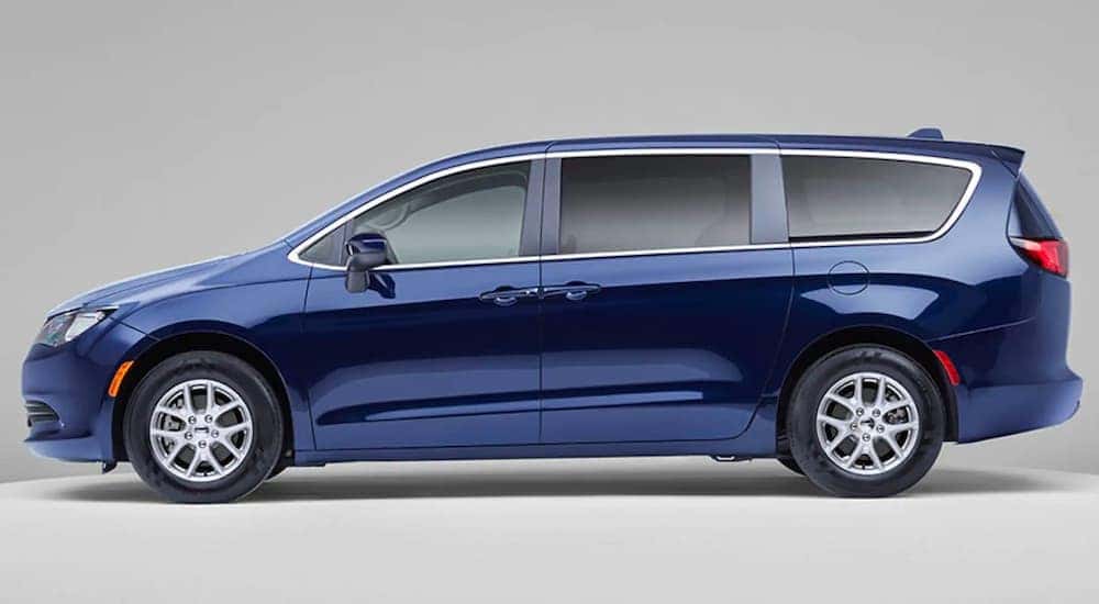 A blue 2021 Chrysler Voyager is show in profile after leaving a Chrysler dealer near you.