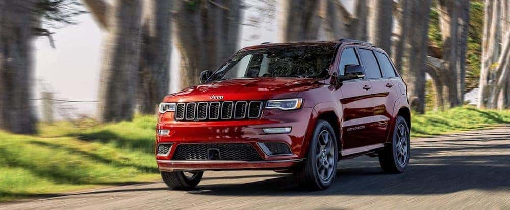 A 2020 Jeep Grand Cherokee driving on a country road