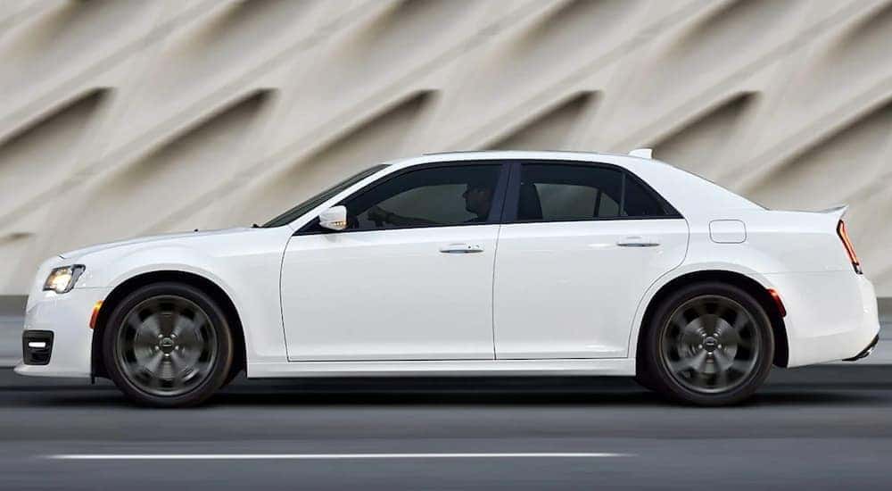 A used white 2019 Chrysler 300 is shown from the side after leaving a Lexington used car dealership.