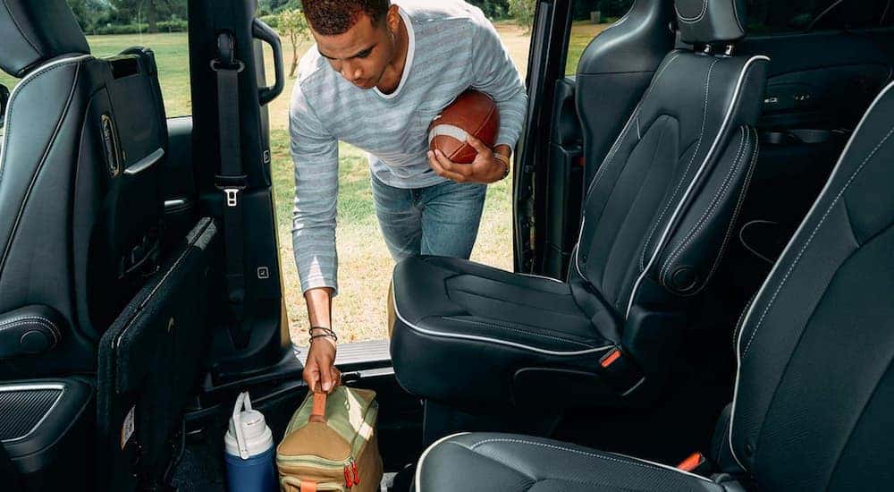 The black interior is shown on a 2021 Chrysler Pacifica Hybrid.