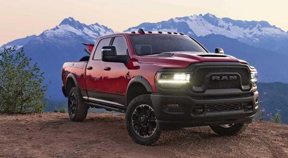 A red 2023 Ram 2500 Rebel is shown parked off-road after visiting a Richmond Ram dealer.