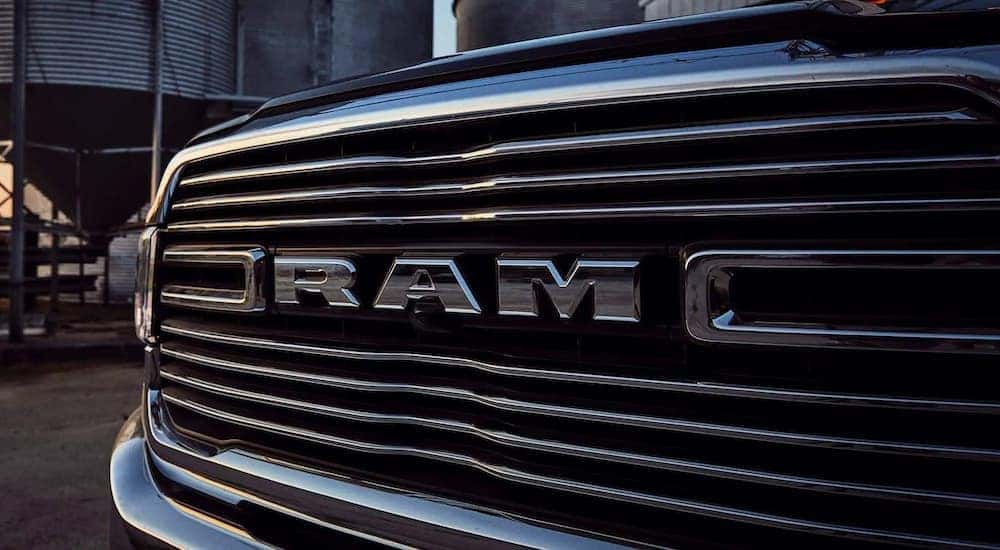 A close up shows the chrome grille on a 2020 used Ram Laramie 2500.