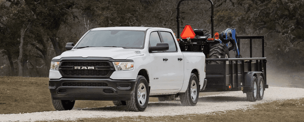 All-New 2019 RAM 1500 towing trailer with tractor in Paris, KY