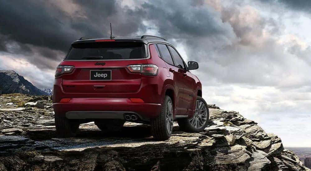 A red 2022 Jeep Compass is shown from the rear after leaving a Jeep dealership in Lexington KY.