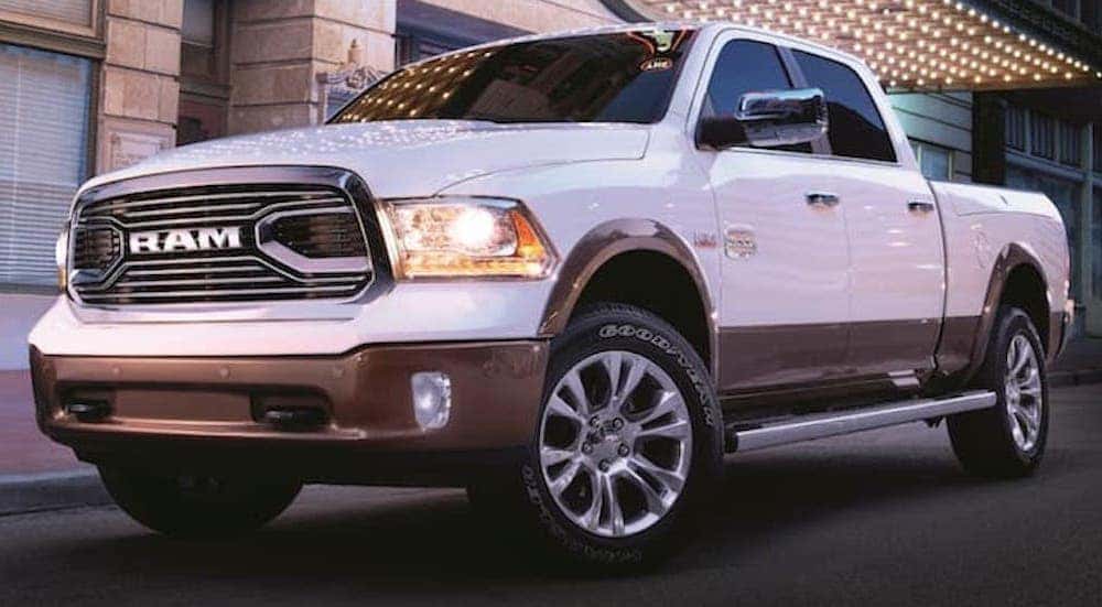 A white 2019 Ram 1500 is shown parked on a city street.