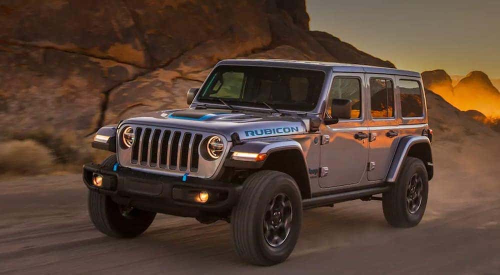 A silver 2021 Jeep Wrangler 4xe is shown from the front at an angle.