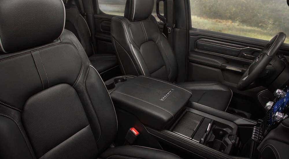 The black interior and front seats are shown in a 2019 Ram 1500 Limited.
