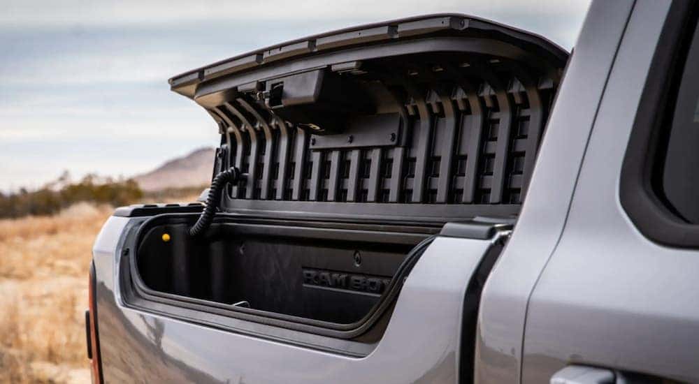 A silver 2021 Ram 1500 has an open travel compartment after leaving a Ram truck dealership in Lexington.